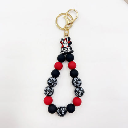 Pulsera de silicona con cuentas de madera y llavero