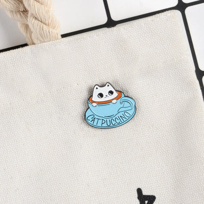 Broche con forma de taza de té azul con forma de gato blanco y bonito recuerdo de cafetería con temática de mascotas