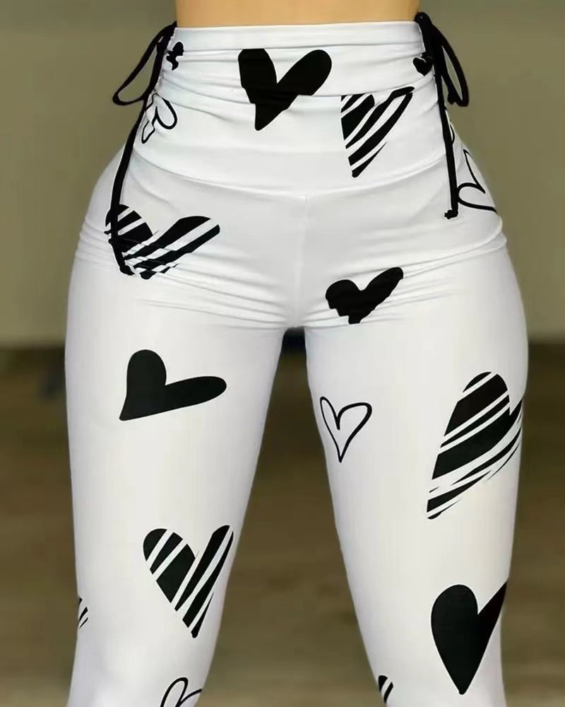 Leggings deportivos de yoga, hip-hop y fitness con estampado de corazones y cordón ajustable