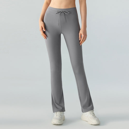 Pantalones de yoga casuales que adelgazan la cintura y levantan la cadera Pantalones de yoga con bolsillos bilaterales y cintura acampanada