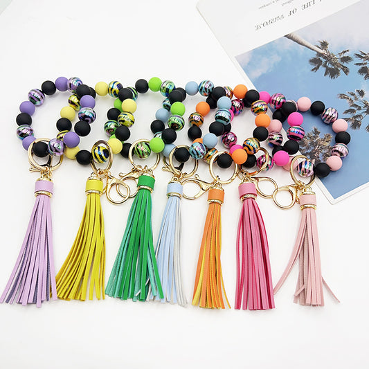 Pulsera de cuentas hecha a mano con borlas y llavero