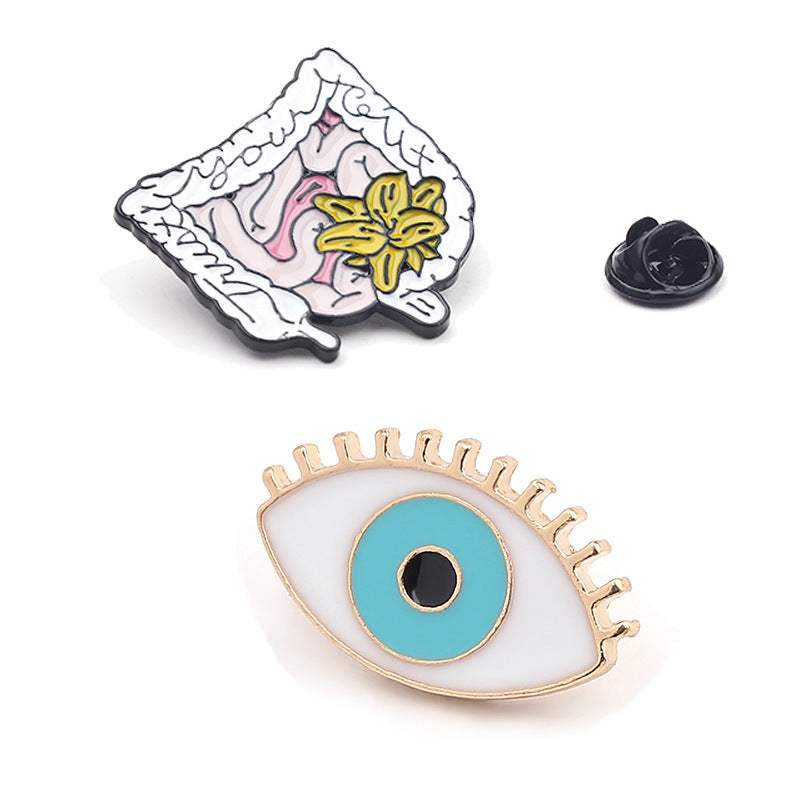 Broche con forma de corazón, pulmón, ojo y capilar en forma de órgano humano