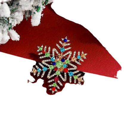 Broche de copo de nieve navideño con incrustaciones de diamantes de imitación de colores y aleación creativa