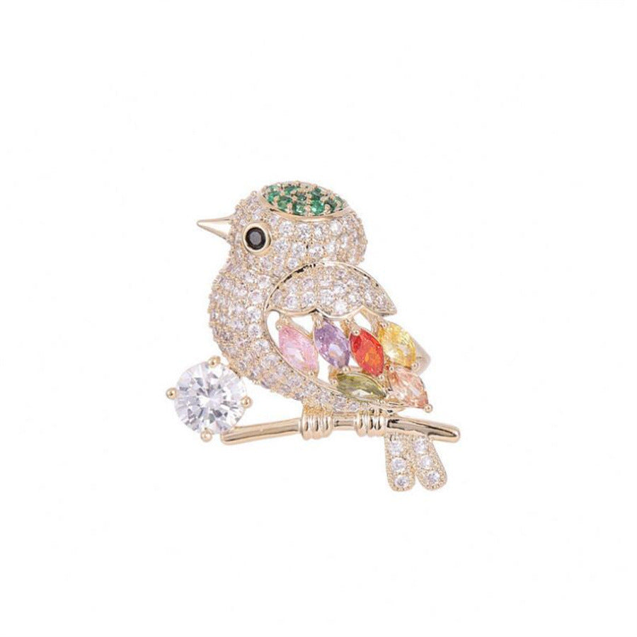 Broche de pájaro urraca con diamantes