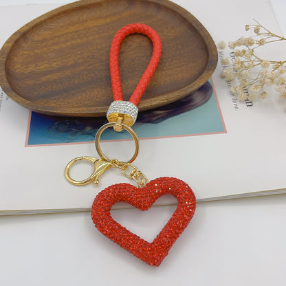 Llavero con forma de corazón hueco de cuerda de cuero y arcilla polimérica, bonito colgante para bolsos de alta gama, colgante pequeño creativo DIY terminado al por mayor